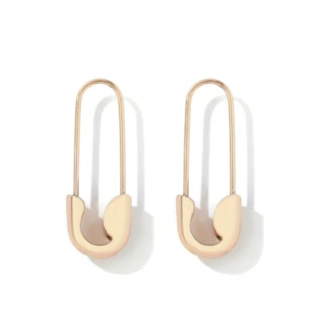 Rose colored safety pin earrings.
